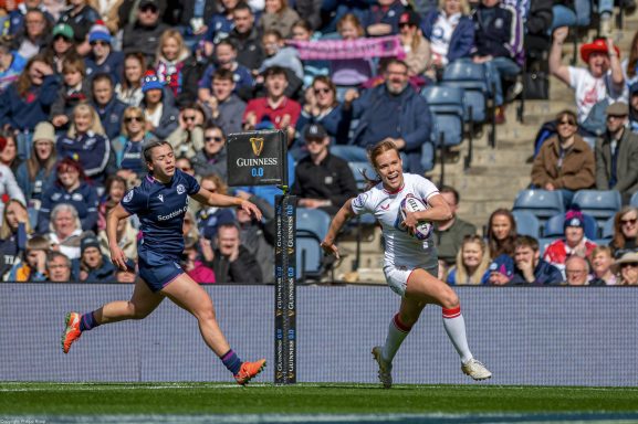 Rugby player carrying the ball during the Women's Six Nations match between Scotland and England in Edinburgh.
